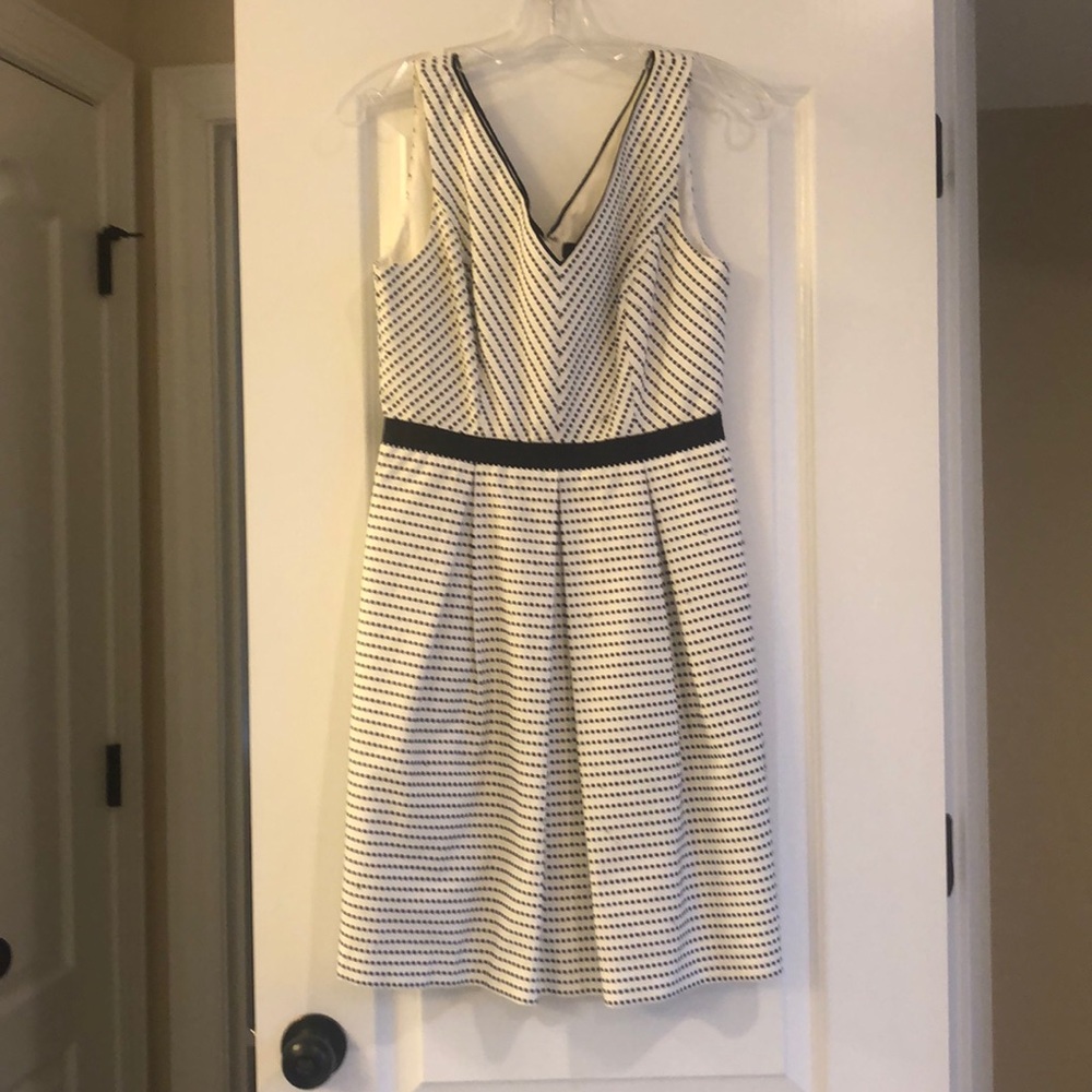 White v-neck dress with black checkers